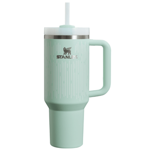A mint green Stanley insulated tumbler with a handle and straw, featuring a design of vertical lines.
