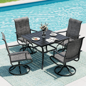 Outdoor patio set with a rectangular table and four swivel chairs by a pool, featuring textured fabric chairs, a black table, a striped rug, and tableware with a vase of flowers.