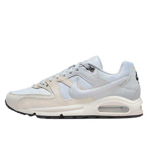 A light gray Nike Air Max sneaker with a visible air unit, featuring a combination of mesh and suede materials, complete with the iconic swoosh logo.