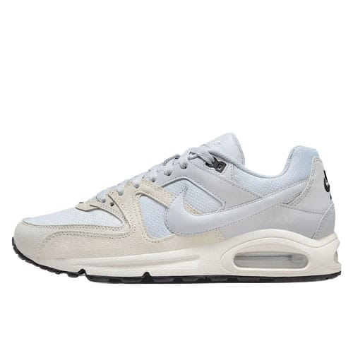 A light gray Nike Air Max sneaker with a visible air unit, featuring a combination of mesh and suede materials, complete with the iconic swoosh logo.