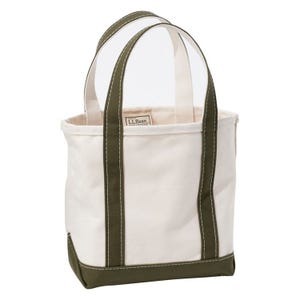 A canvas tote bag with olive green handles and trim, featuring a label that reads \“L.L. Bean.\“