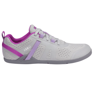 A minimalist athletic shoe with a gray mesh upper, featuring purple and lavender accents, designed by Xero.