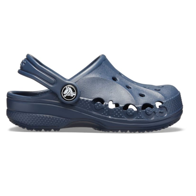 Navy blue clog-style shoe with ventilation holes and a pivoting heel strap.