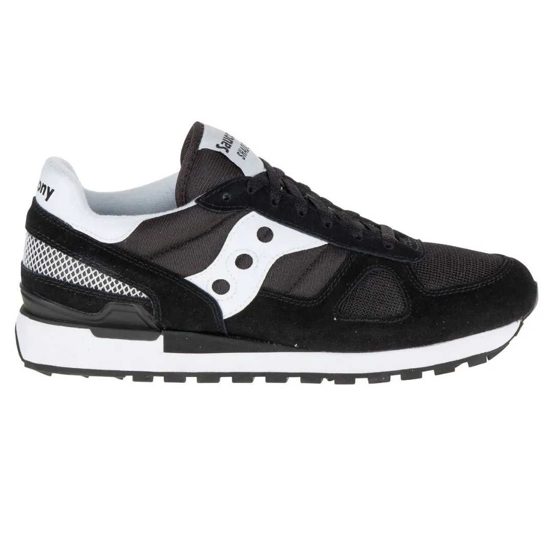 Black and white Saucony Shadow 5000 sneaker with mesh and suede elements, featuring the signature Saucony wave logo on the side.
