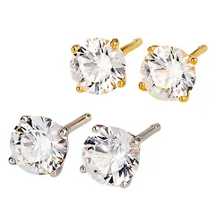 Two pairs of round-cut stud earrings with clear gemstones, one in gold setting and the other in silver setting.