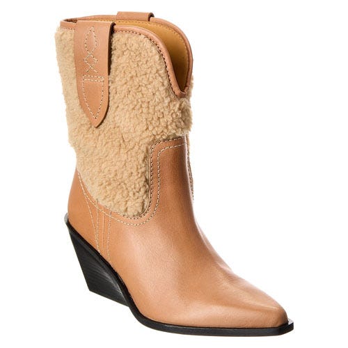 A tan leather ankle boot with a shearling upper, pointed toe, and wedge heel.