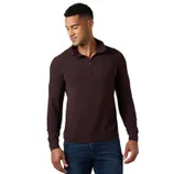 Man wearing a dark brown quarter-zip pullover sweater paired with blue jeans.