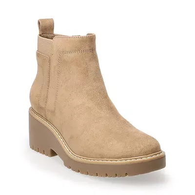 These are light tan ankle boots with elastic side panels, a block heel, and a ridged sole.