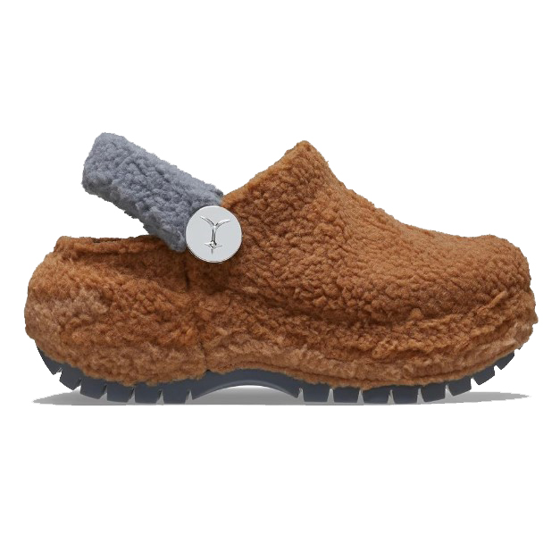 A brown fuzzy clog with a gray strap and a circular logo.