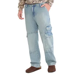Light blue denim cargo pants with multiple pockets, paired with brown slip-on shoes and a camouflage-patterned shirt.