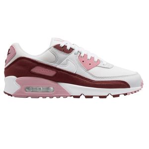 Nike Air Max 90 sneaker in white, pink, and maroon with a visible air cushion in the heel and mesh panel detailing.
