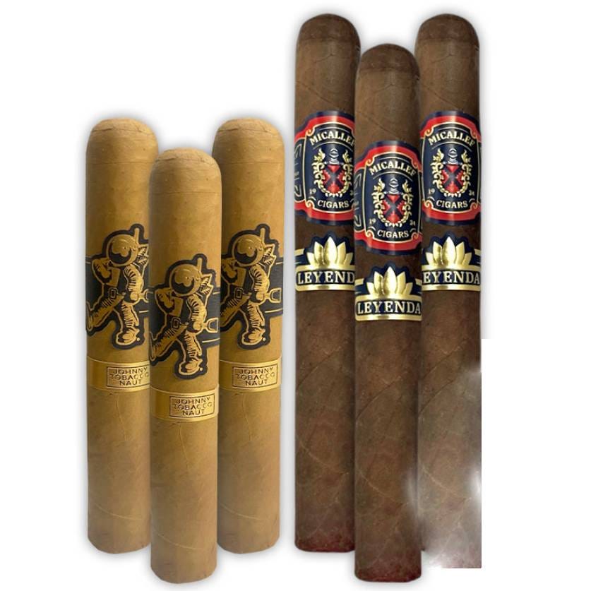 Two types of cigars: \“Johnny Tobacconaut\“ with an astronaut design and \“Micallef Leyenda\“ with a crest and flower motif.