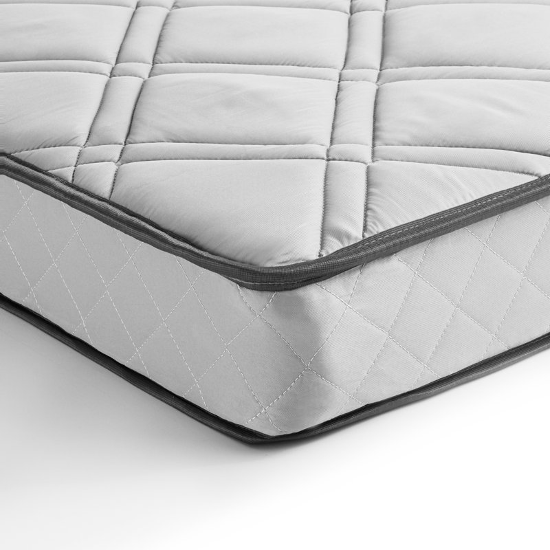 A twin innerspring mattress with a quilted diamond-patterned top and contrasting black edging.