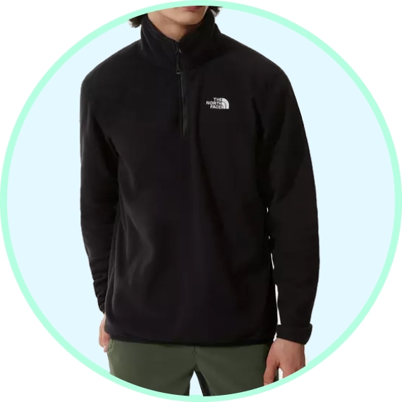A person is wearing a black The North Face half-zip fleece pullover.