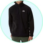 A person is wearing a black The North Face half-zip fleece pullover.