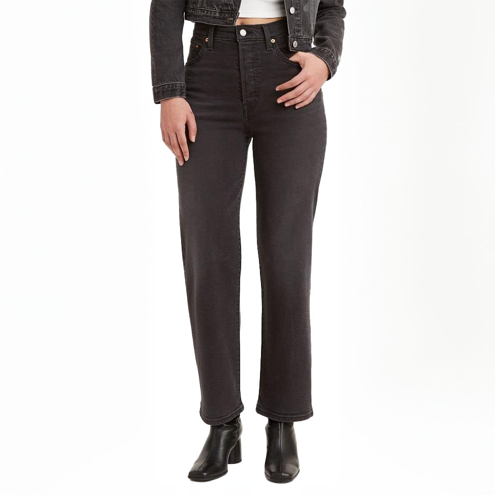 Levi's Ribcage Straight Ankle Jeans feature a high waist, straight leg fit, and ankle-length cut. Shown here in dark denim, they pair well with black ankle boots.