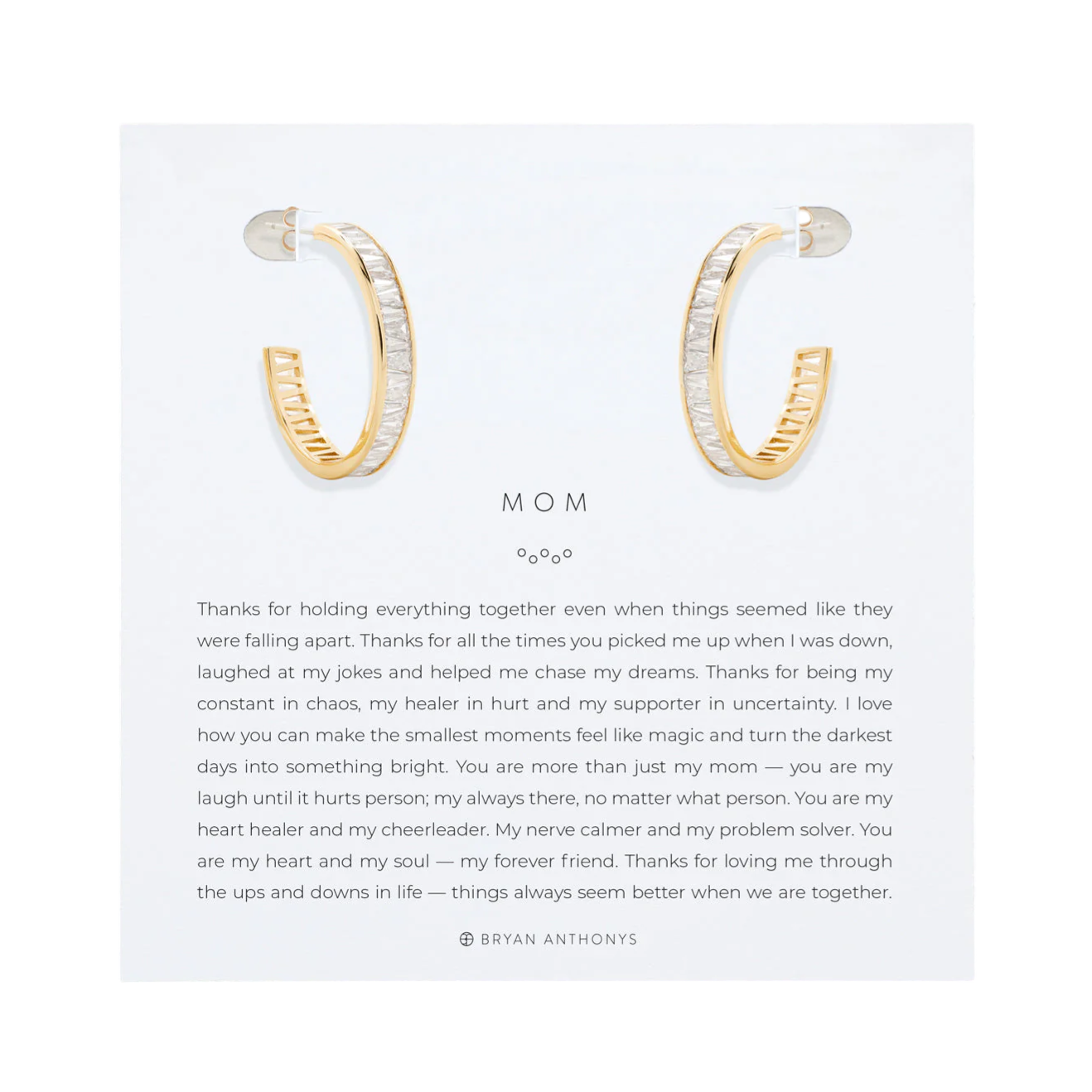 Gold and silver hoop earrings presented on a card with a heartfelt message dedicated to a mother, expressing gratitude and love.