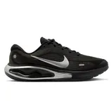 A black Nike running shoe with a silver swoosh logo and a uniquely designed midsole.