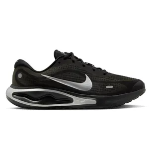 A black Nike running shoe with a silver swoosh logo and a uniquely designed midsole.