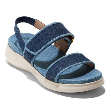 These are blue denim flatform sandals with two wide straps across the top and a brown leather accent on the ankle strap.