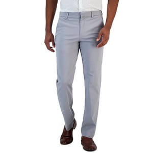 A person is wearing light gray dress pants paired with brown dress shoes and a partially visible white shirt.