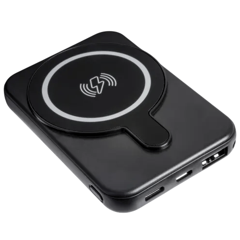 A black wireless power bank with a circular charging pad and multiple input/output ports for charging devices.