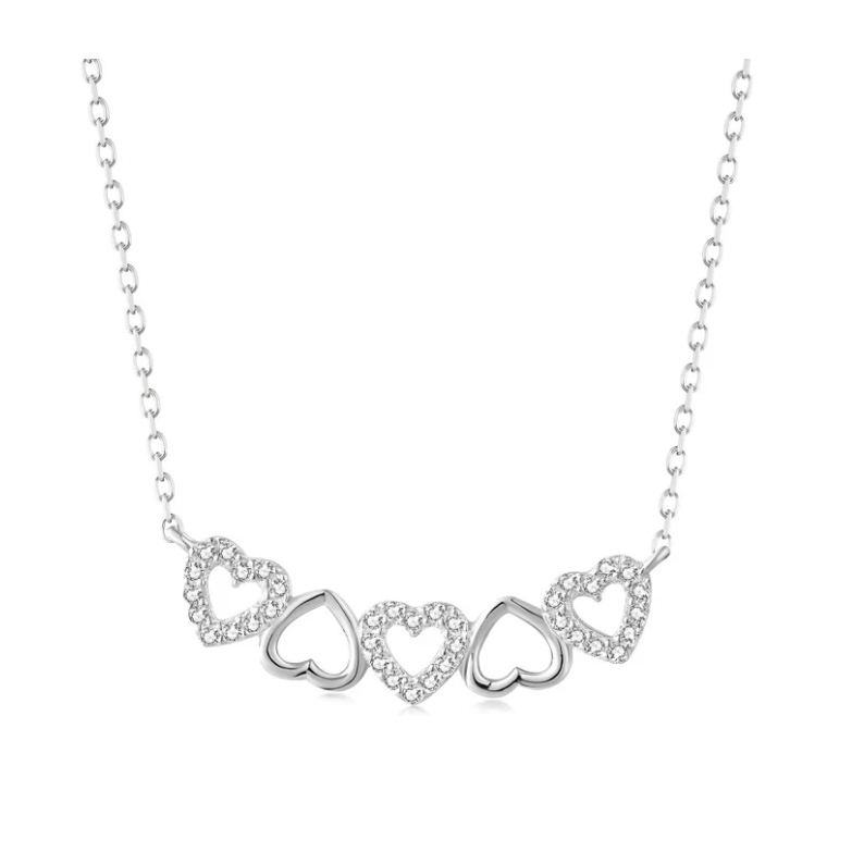 Silver necklace featuring a chain with five heart-shaped pendants, each alternating in design with open hearts and hearts encrusted with small cubic zirconia stones.