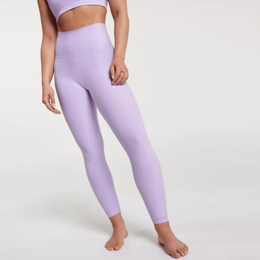 A pair of lavender high-waisted leggings and a matching crop top.