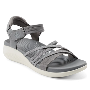 A gray sandal featuring adjustable ankle and crisscross straps, with a cushioned footbed and a slight wedge sole for comfort.