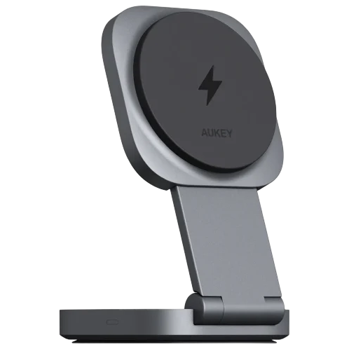 A grey Aukey wireless charging stand with a foldable design and a lightning bolt symbol on the charging pad.