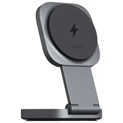 A grey Aukey wireless charging stand with a foldable design and a lightning bolt symbol on the charging pad.