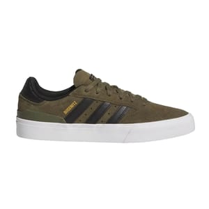 A green and black Adidas skate shoe with \“BUSENITZ\“ in gold text on the side, featuring the signature three stripes and a white rubber sole.