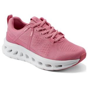 Pink athletic sneaker with breathable mesh upper, lace-up design, and white cushioned sole featuring cut-out details.