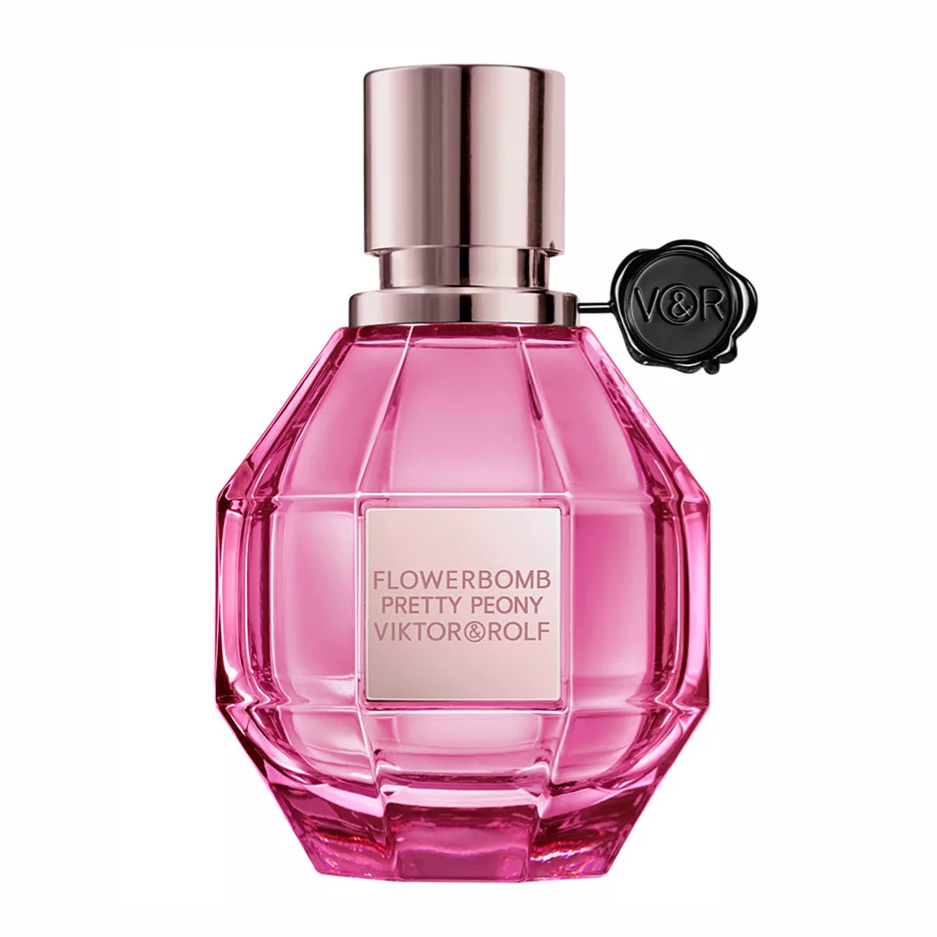 Viktor & Rolf Flowerbomb Pretty Peony perfume in a faceted pink bottle with a metal cap and a V&R emblem hanging on the side.