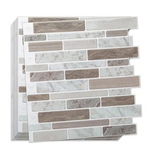 A set of peel-and-stick backsplash tiles featuring a mix of beige, brown, and white marble patterns in a brick-like arrangement.
