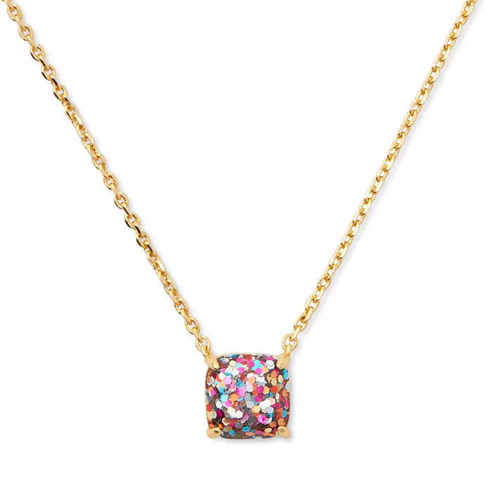 Gold chain necklace with a square, multicolored glitter pendant.