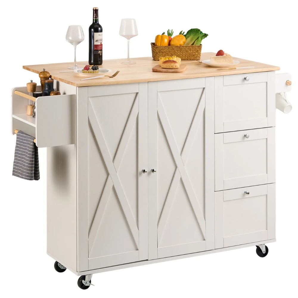 White kitchen island cart with a wooden top, featuring storage drawers, cabinets, side shelf with spice holders, towel rack, and rolling casters. It is topped with wine, glasses, a cutting board, and a basket of vegetables.