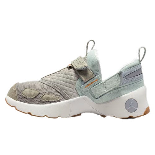 A single gray and light green sneaker featuring a quilted design, with a white midsole and gum outsole, and subtle branding including a round logo near the heel.