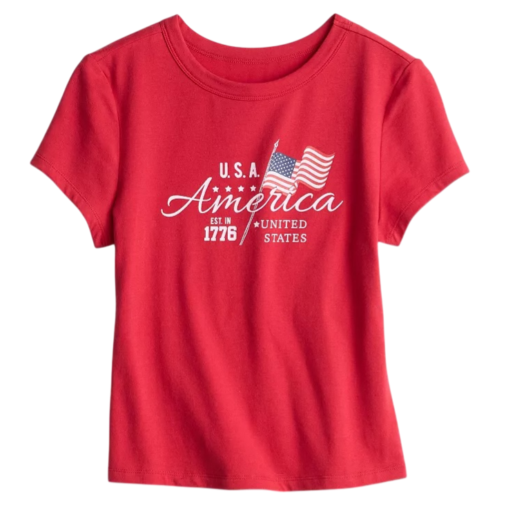 A red T-shirt featuring the text \“U.S.A. America Est. in 1776 United States\“ with an American flag graphic.
