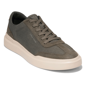 Olive green sneaker with beige sole and lace-up design.