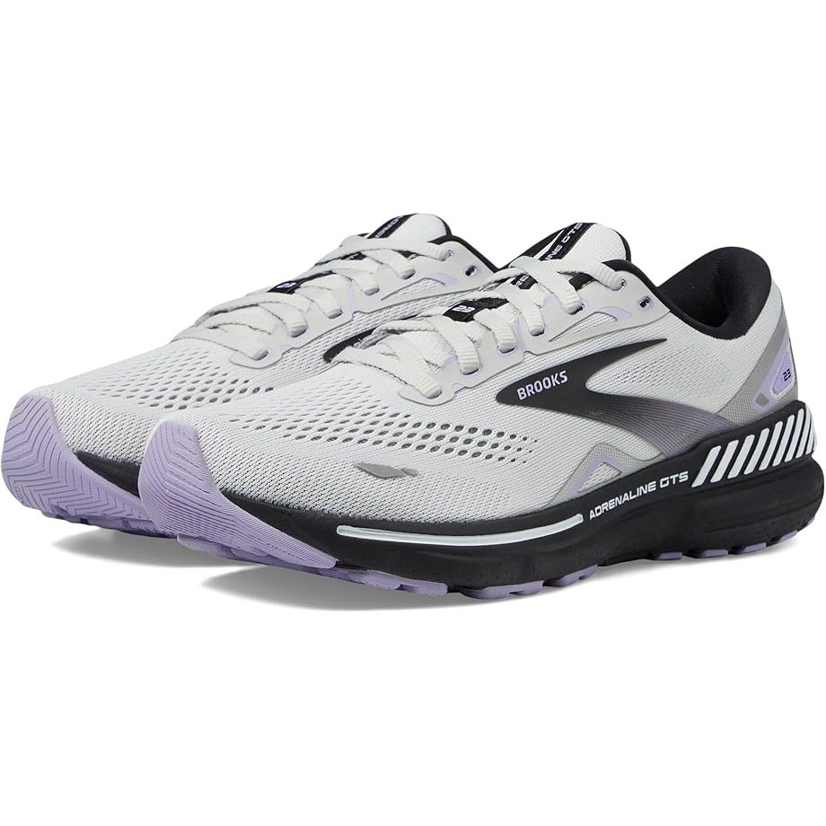 Pair of Brooks Adrenaline GTS running shoes with a light gray mesh upper, black details, and lavender accents on the soles. Designed for comfort and support, featuring lace-up closure and cushioned soles.