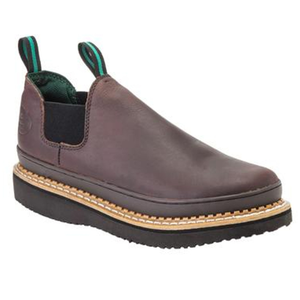 Brown slip-on leather shoe with black elastic side panels, green interior lining, dual pull-tabs with green stripes, and a thick black ridged sole with tan stitching.