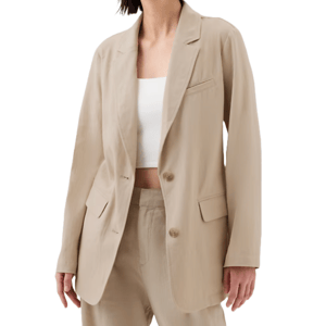 A beige linen-blend blazer with notched lapels, front flap pockets, and a single front button closure, paired with coordinating trousers.
