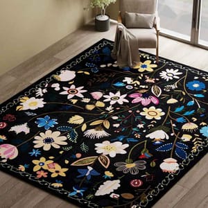 A 5' x 8' modern floral area rug with a black background adorned with colorful flower and leaf patterns in shades of blue, pink, yellow, and white, featuring a decorative border.