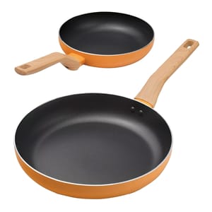 Two non-stick frying pans with orange exteriors and wooden handles are shown.