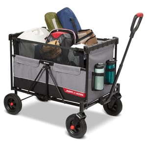The Radio Flyer Beast Wagon is a sturdy, collapsible utility cart for transporting items. It features a grey and black frame, four wheels, mesh storage pockets, water bottle holders, and a long handle.