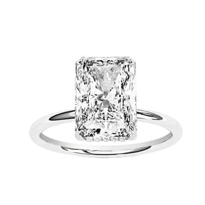 A ring featuring a large, rectangular radiant-cut diamond set on a simple white gold or platinum band.