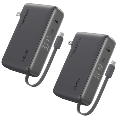 Two Aukey 10,000mAh power banks with built-in USB-C cables and digital displays for charging information.