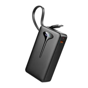 A black portable power bank with an attached micro-USB cable and a digital display showing the battery percentage.