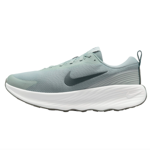 Nike running shoe with a light green mesh upper, white textured sole, and a dark Nike swoosh logo.